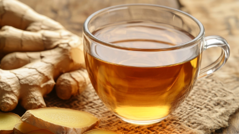 Ginger tea with ginger root on a table