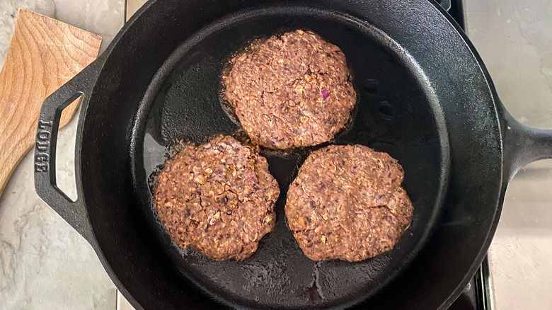 Black bean burgers in pan