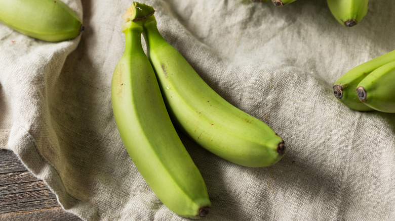 Green bananas on cloth