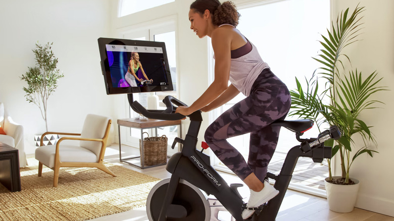 woman riding proform bike