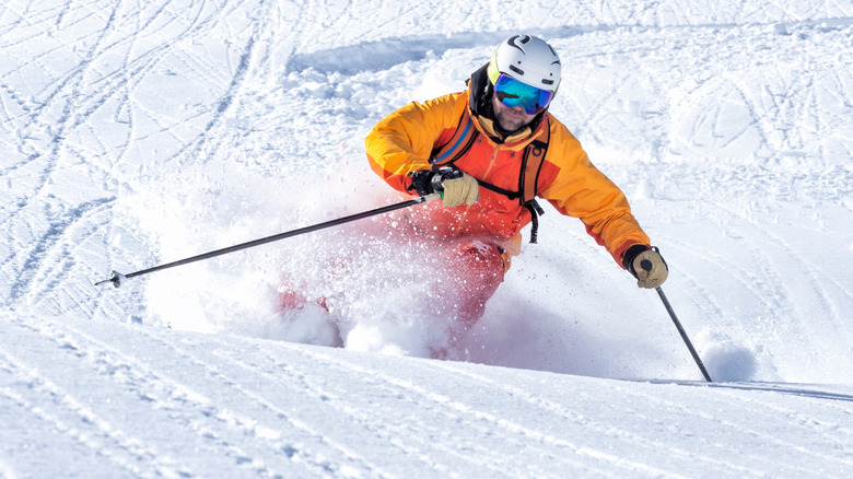 man skiing in full gear