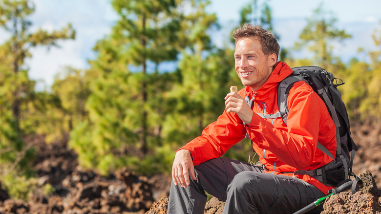 hiker sitting and enjoying outdoors