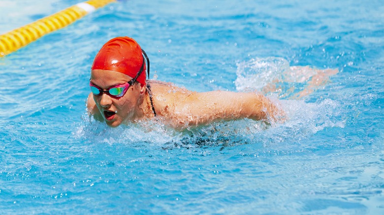 person swimming in pool