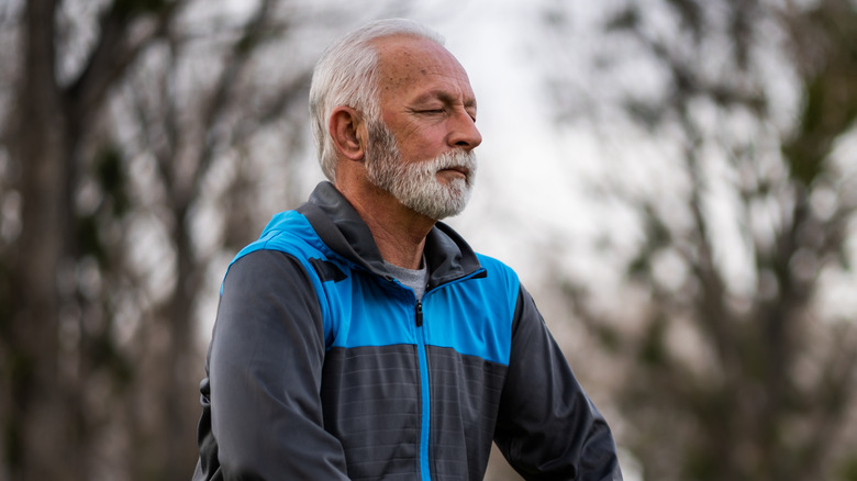 man doing tai chi outdoors