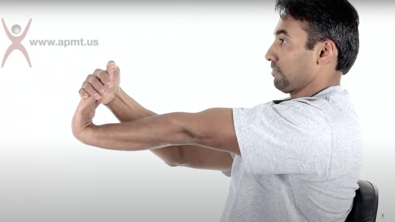 man doing wrist extension