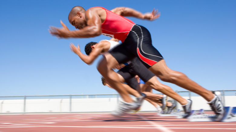 Group of men sprinting