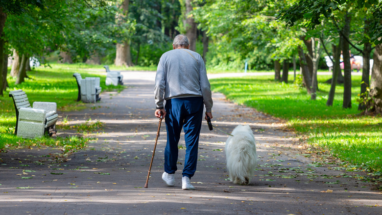 older person walking with stoop