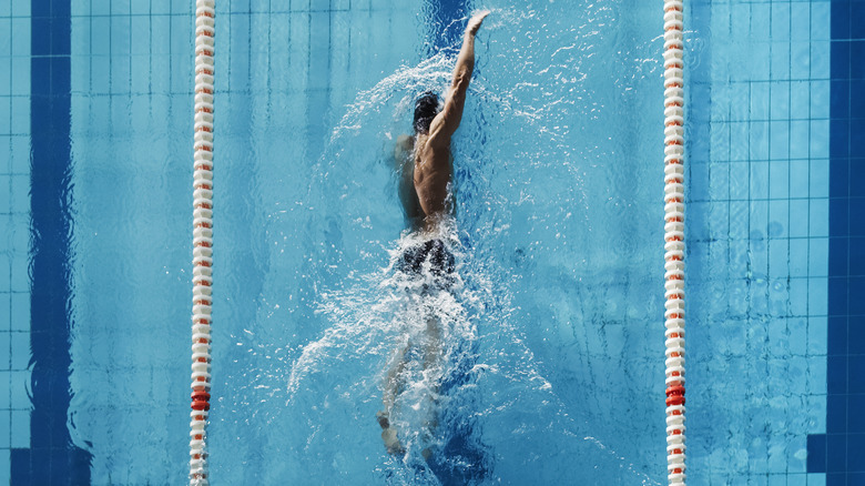 Man swimming in Olympic pool
