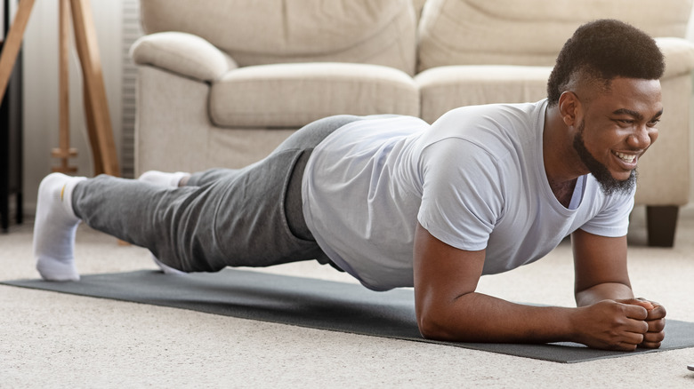 man in forearm plank pose
