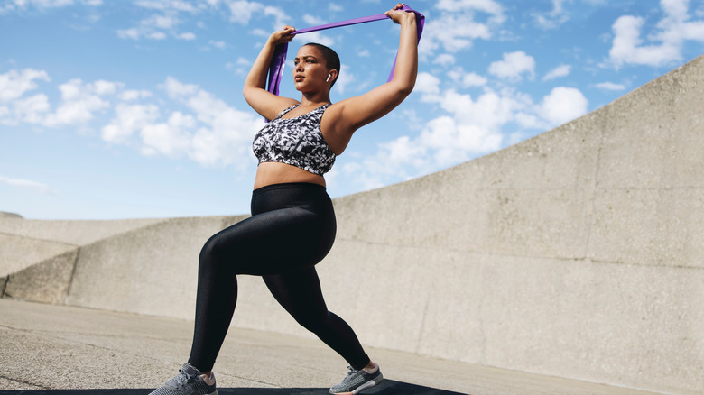 Woman working a resistance band 