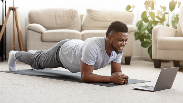 man doing plank at home