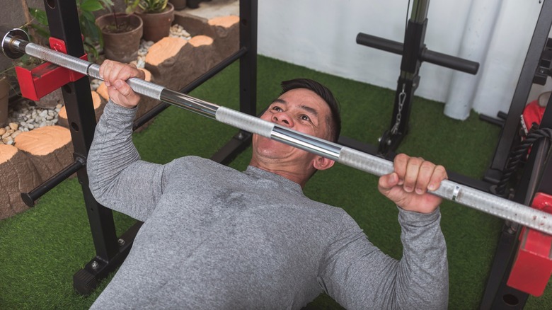 man doing inverted row