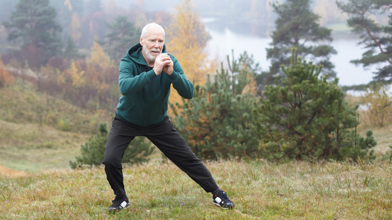 man doing lateral lunge