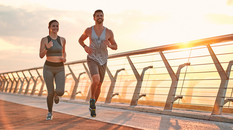 man and woman jogging