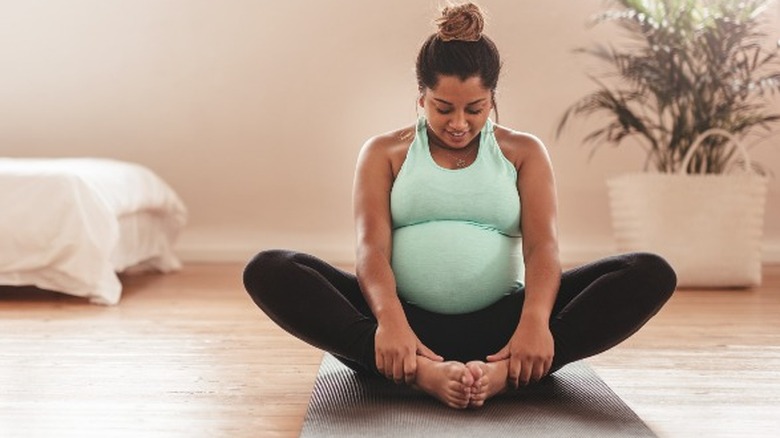 Pregnant woman doing bound angle