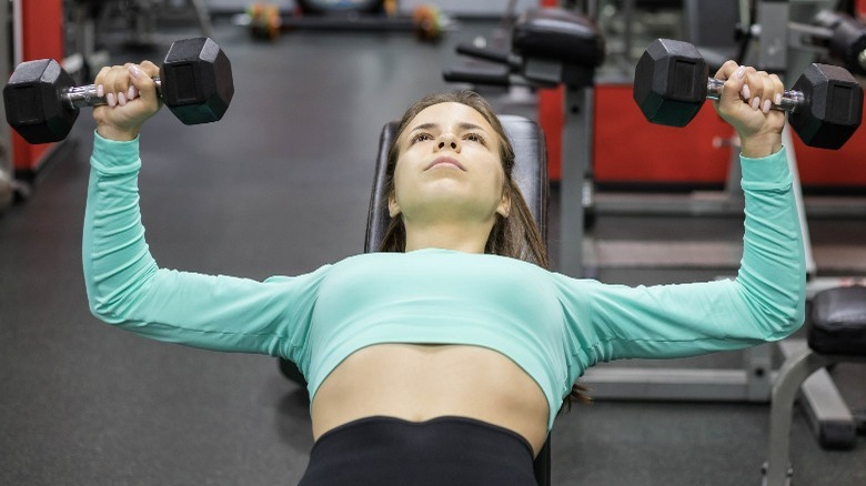 Woman doing chest presses