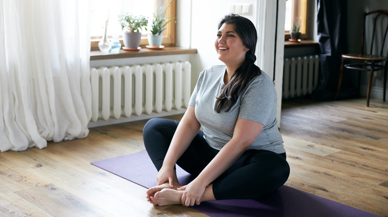 Woman working her pelvic floor muscles 