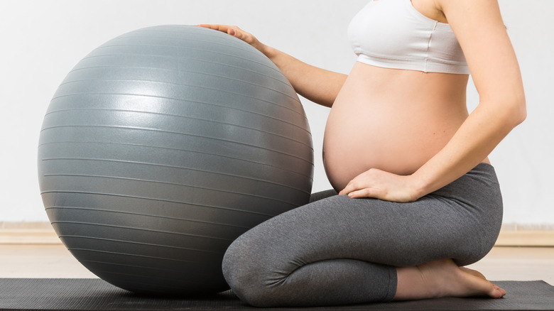 pregnant woman with bounce ball 