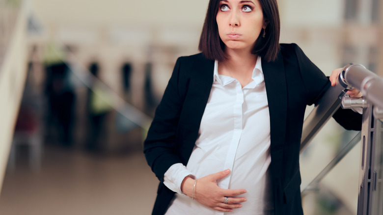 pregnant woman climbing stairs 