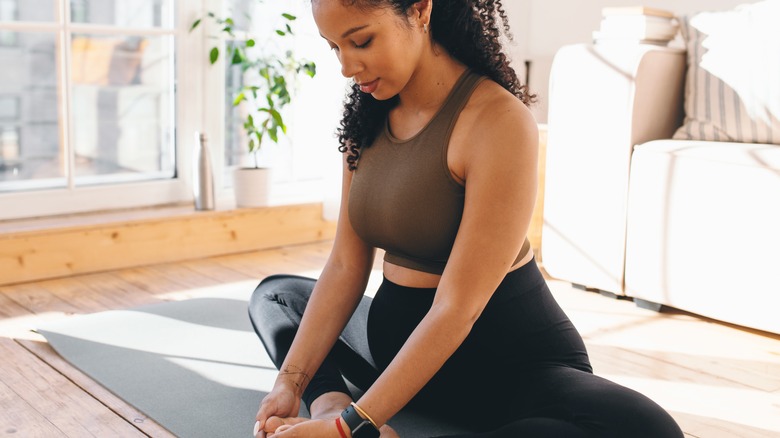 pregnant woman in butterfly pose