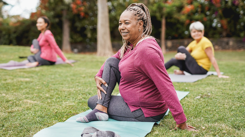 people doing pilates on grass