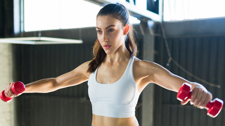 woman doing lateral raises