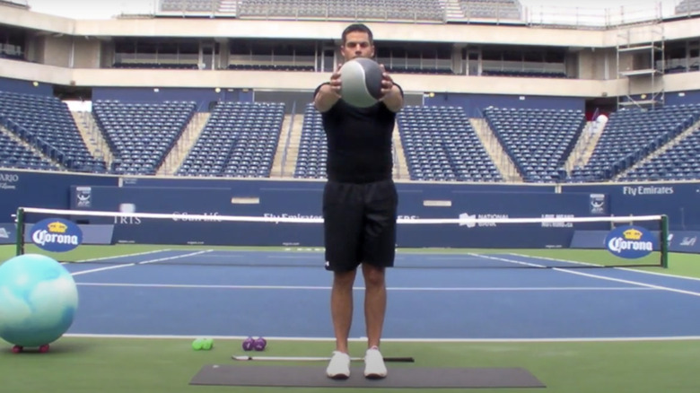 man holding medicine ball