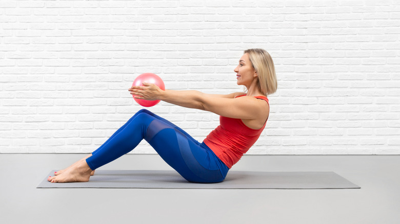 woman doing half roll back