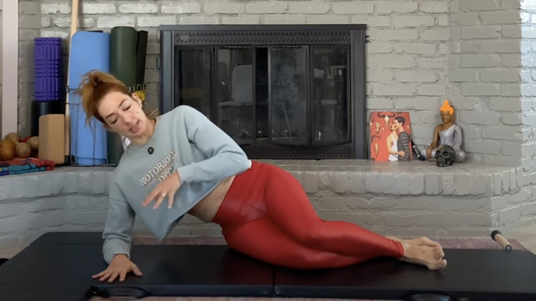 woman doing side bend preparation