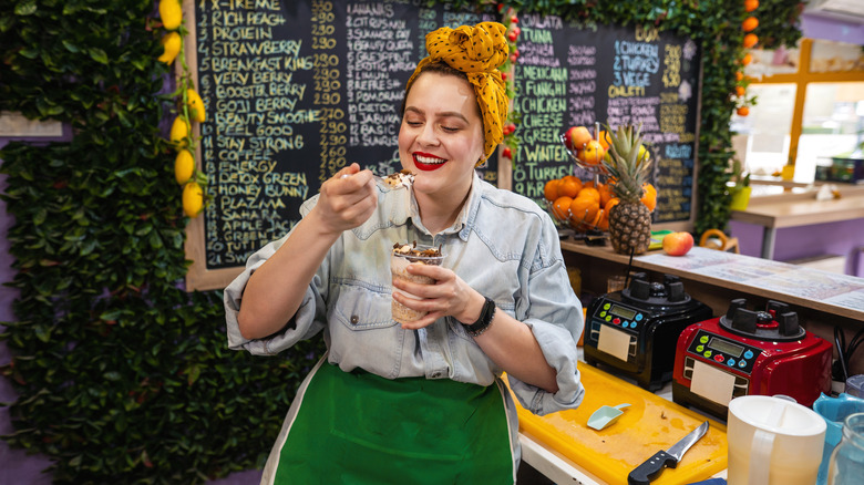 Person eating greek yogurt