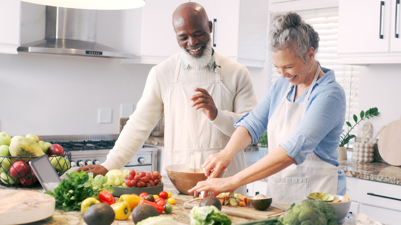 older couple making healthy meal