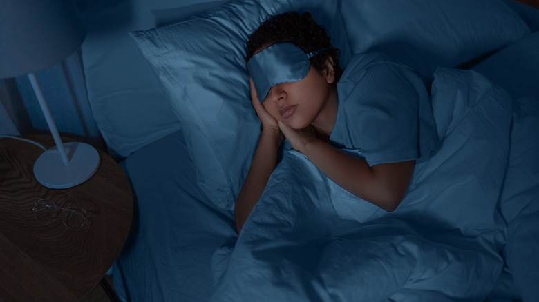 Sleeping with blue sleep mask