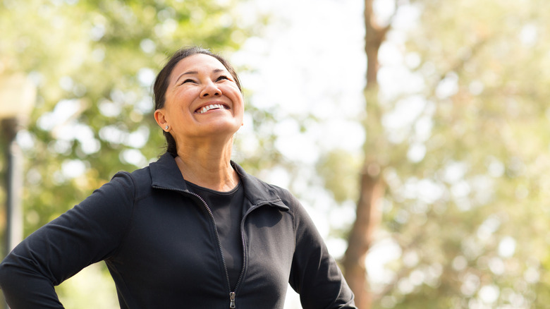 woman smiling and walking