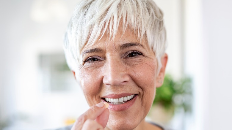 woman taking pill