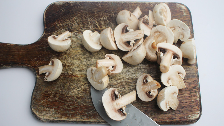 Sliced mushrooms on a cutting board