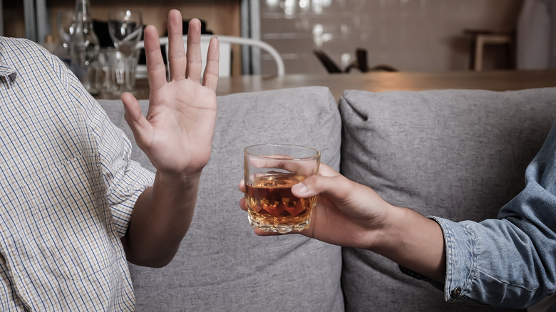 Man saying no to alcoholic drink