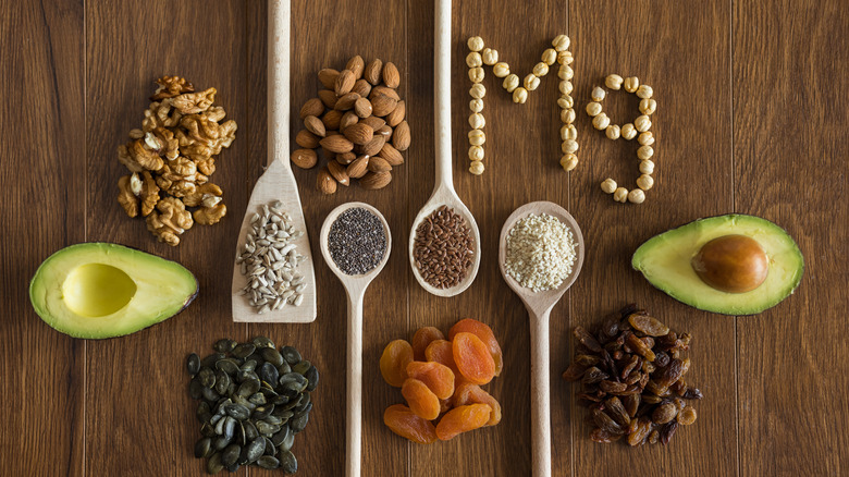 Magnesium-rich foods on wooden table and spoons