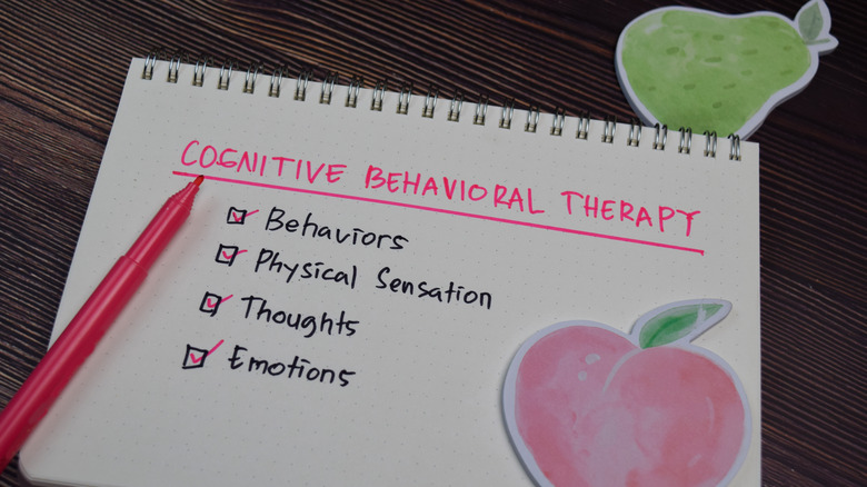 Cognitive Behavioral Therapy concept written on notebook