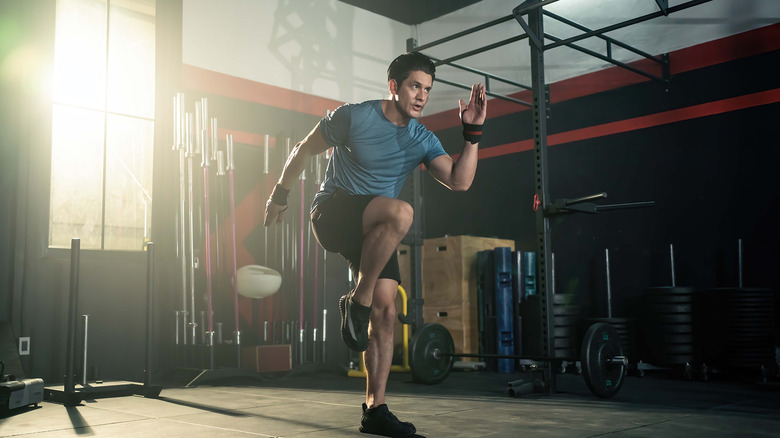 Man performing workout in gym