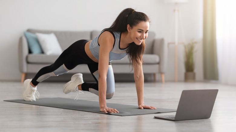 Woman performing mountain climber exercise