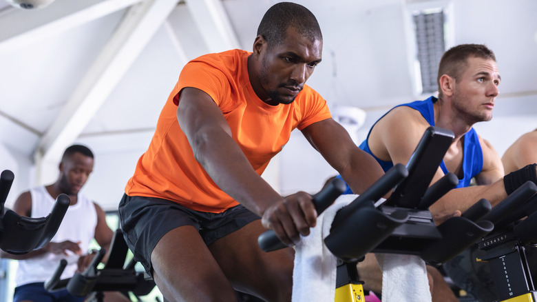 Man spinning on spin bike