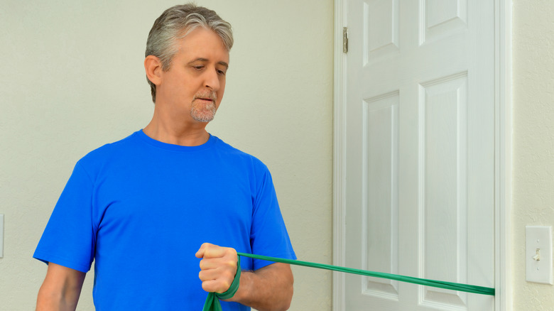 Man using resistance bands