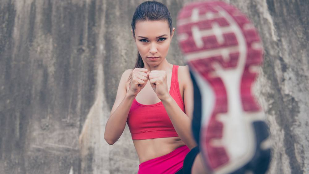 woman kicking her shoes up