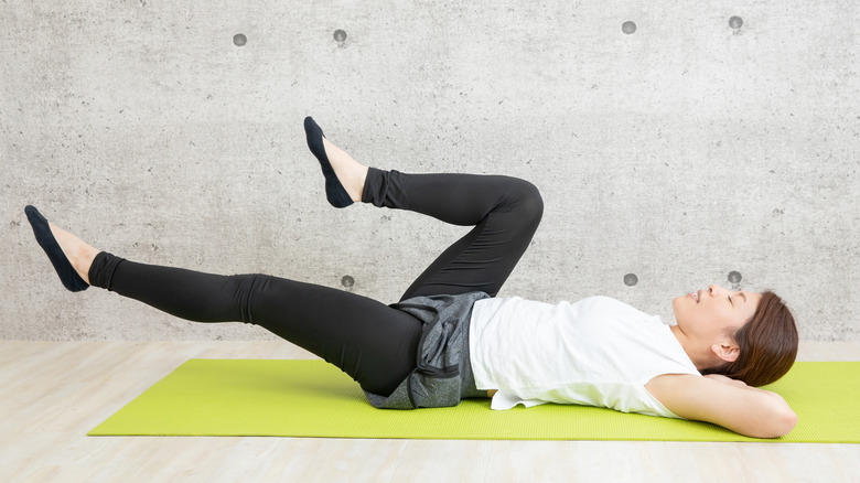 yoga woman cycling pose