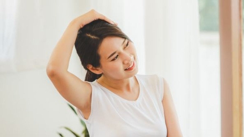 woman stretching neck for relaxation