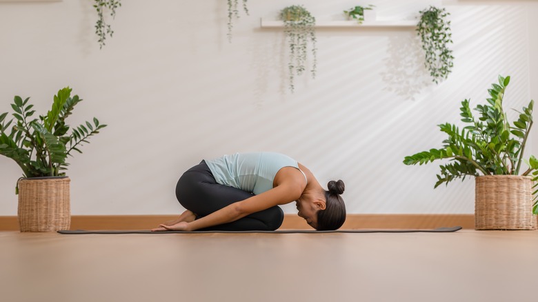 woman doing child's pose