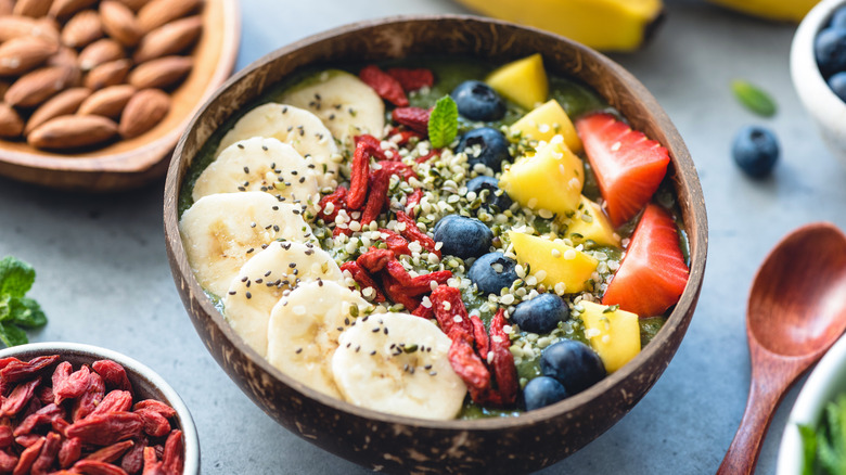 A smoothie bowl with chia seeds and hemp seeds on top