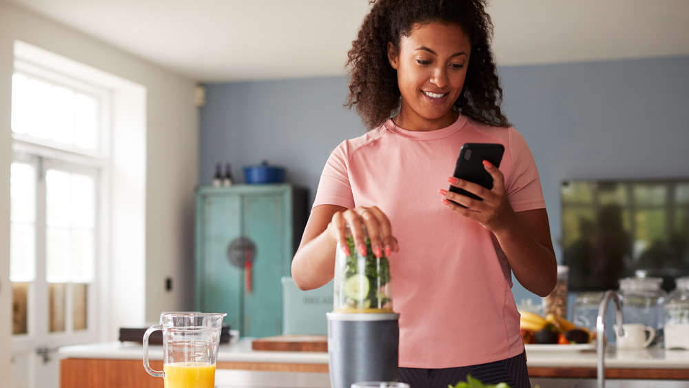 woman tracking calories on phone