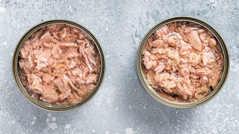two opened cans of canned tuna