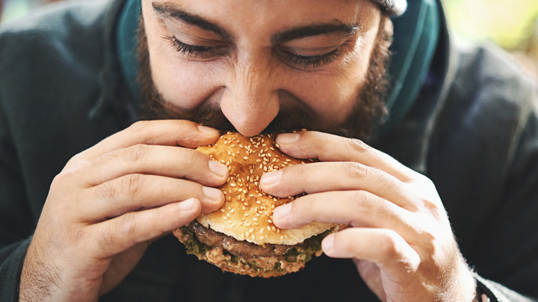 Man eating burger